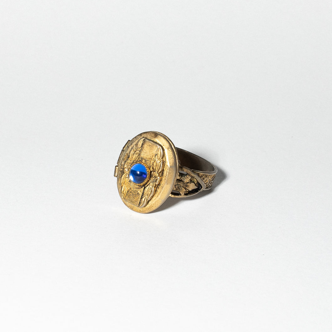 Gold Tone Locket Ring with Blue Cabochon